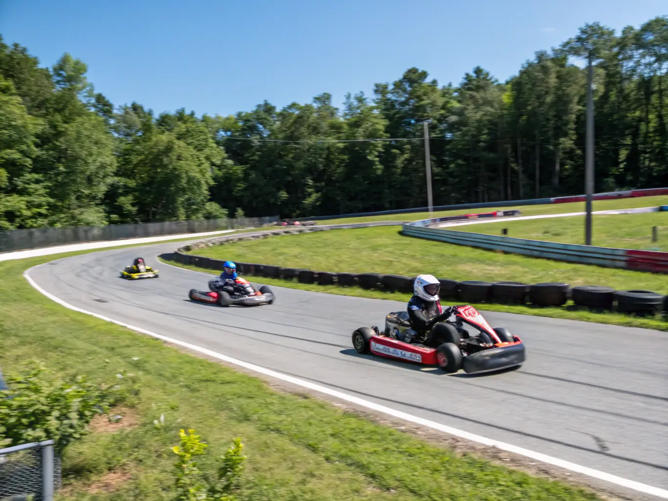 An image of young participants racing radio-controlled cars on a well-organized track, showcasing excitement and technical skill.